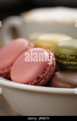 mixed macarons in bowl closeup shot Stock Photo