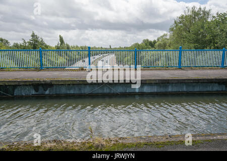 View of Ash Aqueduct on the Basingstoke Canal in Surrey, UK, with the dual carriageway in the distance Stock Photo