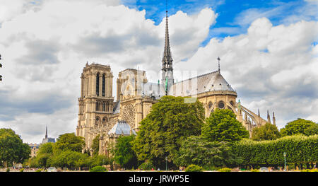 Paris, FRANCE - july 11, 2017: Wide shot of Notre-Dame cathedral in Paris, France with its gardens and tourists visiting the French capital Stock Photo