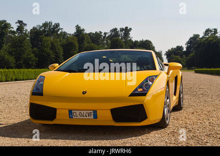 A yellow Lamborghini in Stupinigi park. Vintage cars and sportscar on exhibition in Torino during Parco Valentino car show. Stock Photo