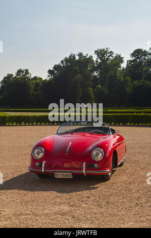 A red Porsche 1600 Speedster in Stupinigi park. Vintage cars and sportscar on exhibition in Torino during Parco Valentino car show. Stock Photo