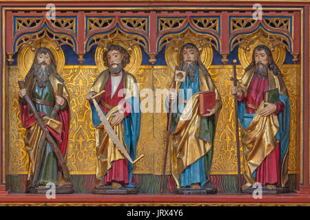 BERLIN, GERMANY, FEBRUARY - 16, 2017: The carved statue of apostles Andrew, Simon, Jude Thaddheus and James the Great in church of St. Pauls by unknow Stock Photo