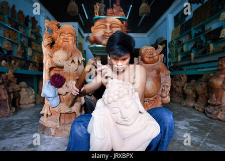 Hoi An Old Town crafts Kim Bong Traditional Carpentry workshop man carving outside workshop, Vietnam Stock Photo