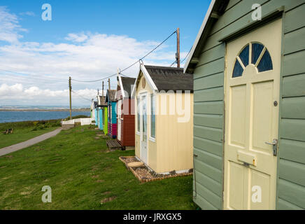 Colorful beach side huts on Devon coast of England Stock Photo