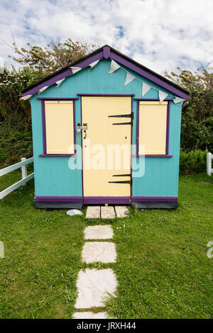 Colorful beach side huts on Devon coast of England Stock Photo