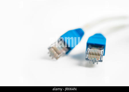 Network cable with RJ 45 connector on white background Stock Photo