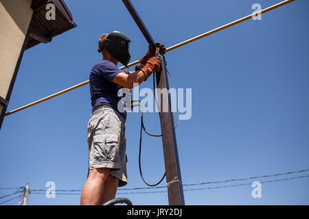 welding backyard metal man construction alamy