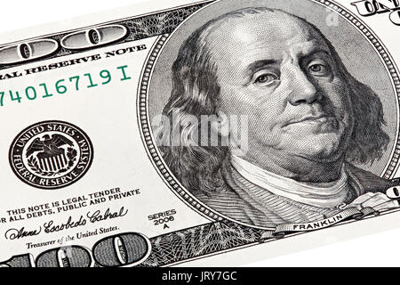 Stack shot of Benjamin Franklin portrait from a 100 bill. Stock Photo