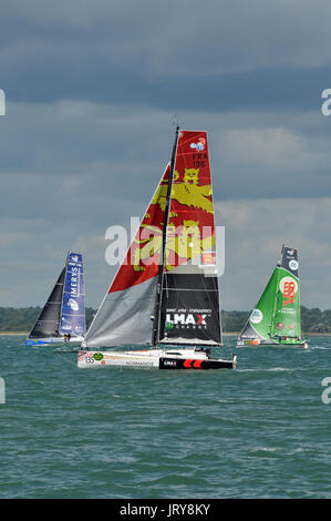 Yachts in th fastnet rock race sailing racing in the Solent after the start at Cowes Isle of Wight in fair conditions windy sails sailing Stock Photo