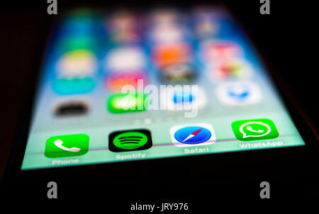 Luminous display, screen, iPhone, many different app icons, app, cell phone, smartphone, iOS, macro shot, detail, full frame Stock Photo
