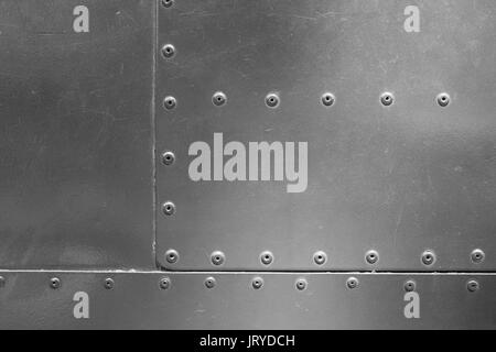 Metal plate with rivets background Stock Photo