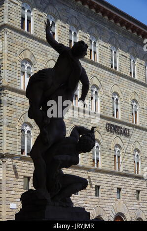 Florence,IT - August 05, 2017 -  Silhouette of 'Il ratto delle Sabine' statue by Giambologna, withe the medieval center of Florence in the background. Stock Photo