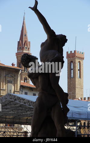 Florence,IT - August 05, 2017 -  Silhouette of 'Il ratto delle Sabine' statue by Giambologna, withe the medieval center of Florence in the background. Stock Photo