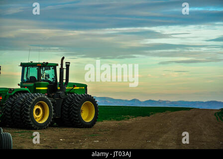 A tractor at the ready for spring seeding time Stock Photo