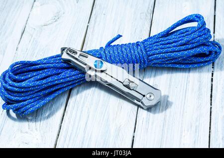 lassic iron knife with an iron grip in folded form. White knife on white background. Stock Photo