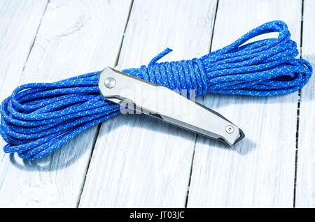 A classic iron knife with an iron grip in folded form. White knife on white background. Stock Photo