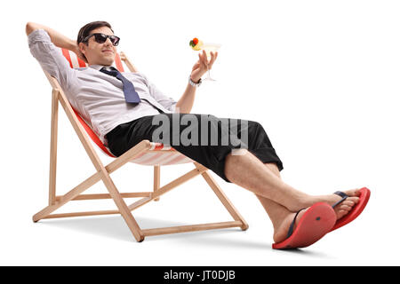 Businessman with a cocktail relaxing in a deck chair isolated on white background Stock Photo