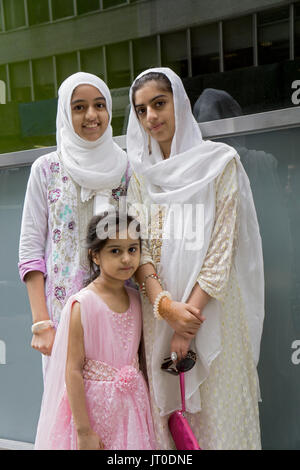 Pakistani sisters wearing hijabs at the annual Pakistan Day Parade ion Midown Manhattan, New York City. Stock Photo