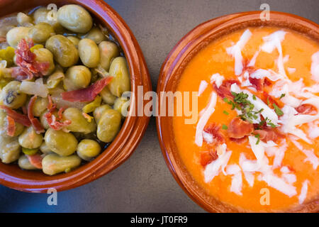 Tapas typical spanish gastronomy and food, Broad beans with Ham, Salmorejo soup. Málaga province. Andalusia, Southern Spain Europe