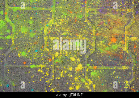 Multi-colored earth, paving slabs, powder coated with dry colors at the Holi festival in Gatchina, Russia Stock Photo