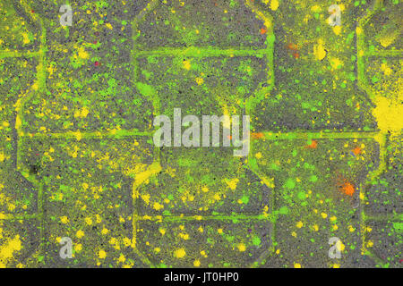 Multi-colored earth, paving slabs, powder coated with dry colors at the Holi festival in Gatchina, Russia Stock Photo