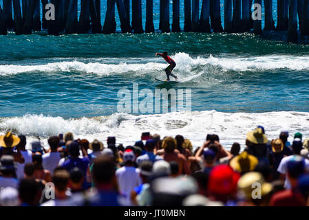 Huntington Beach, USA. 06 August, 2017. Kanoa Igarashi (USA) puts local knowledge to use doing the 'Huntington Hop' in order to link together powerful turns on the outside and inside sections on the south side of the HB Pier, earning himself not only the win but also highest wave score in the entire 2017 VANS US Open of Surfing  during the finals in front of hundreds of thousands of fans in Huntington Beach, CA. Credit: Benjamin Ginsberg/Alamy Live News. Stock Photo