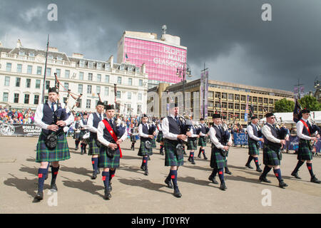 George Square, Glasgow, Scotland, UK. 7th Aug, 2017 Piping Live! - the Glasgow International Piping Festival began today under threatening skies. Pipe bands from around the world will be performing and competing at the week long bag pipe festival ahead of the World Pipe Band Championships also held in Glasgow on the 11th and 12th August Credit: Kay Roxby/Alamy Live News Stock Photo