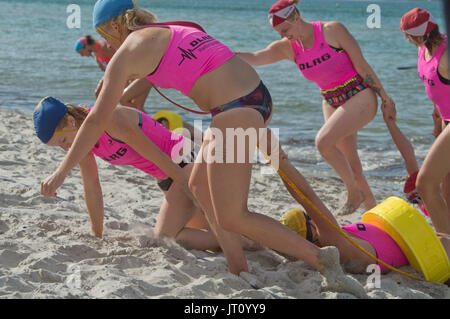 Prerow, Germany. 5th Aug, 2017. Life-guards in action during 'Rescue Tube Race Women' of the DLRG trophy 'Contest in open sea rescue swimming' at the beach of Prerow, Germany, 5 August 2017. The contest includes three competitions; the first was in Haltern-am-See, the third will be Langlau, Germany. Photo: Stefan Sauer/dpa-Zentralbild/dpa/Alamy Live News Stock Photo