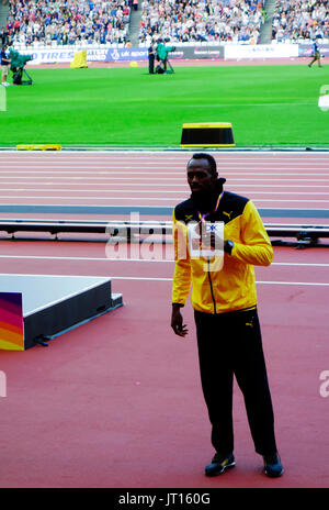 Usain Bolt poses with his bronze medal at the men's 100m award ceremony at the London 2017 IAAF World Championships in London, Britain, 06 August 2017 Stock Photo