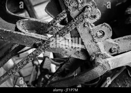 A closeup of the levers on an old, antique tractor, from the early 1950's, showing the rough texture from the weathering and rust. Stock Photo