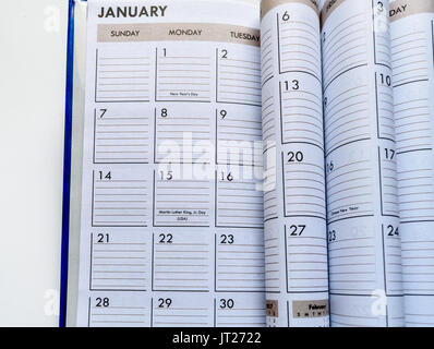 Closeup of Calendar showing January with folded pages. Stock Photo