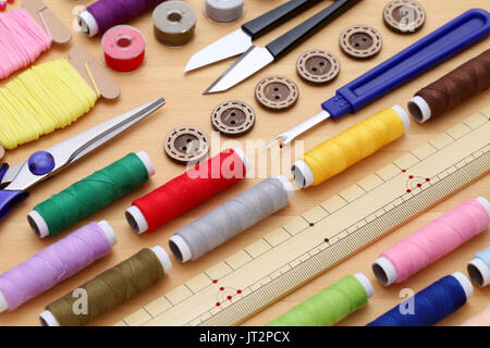 sewing tools, tailoring and fashion concept - close-up on wooden table
