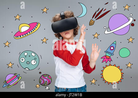Boy wearing virtual reality headset Stock Photo