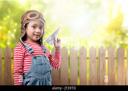 Happy asian children with avitor custome having fun at outdoor Stock Photo