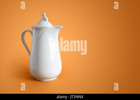 White Ceramic Milk Pot On A White Background Stock Photo, Picture and  Royalty Free Image. Image 50381901.