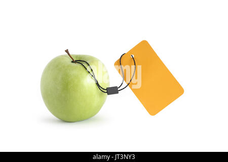 Freshness green apple with blank yellow paper label on white background. Isolated with clipping path Stock Photo