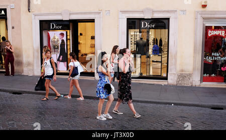 Rome Italy July 2017 - Shoppers pass by the famous Dior store in Tridente district Stock Photo