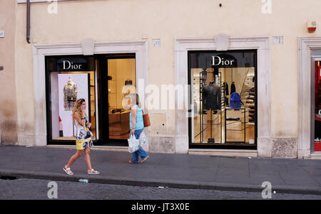 Rome Italy July 2017 - Shoppers pass by the famous Dior store in Tridente district Stock Photo