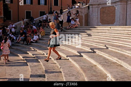Rome Italy July 2017 - Female tourist casts a long shadow on The Spanish Steps in Tridente Photograph taken by Simon Dack Stock Photo