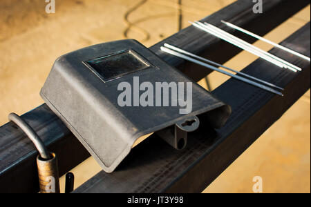 Welding tools on the big piece of metal Stock Photo