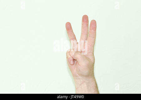 Account concept one.ru human shows three fingers. Photo for your design Stock Photo