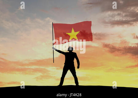 Male silhouette figure waving Vietnam flag. 3D Rendering Stock Photo