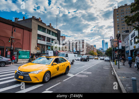 NEW YORK, USA - October 13, 2016.  Yellow Hybrid Electric Taxi in Greenwich Village, NYC Stock Photo
