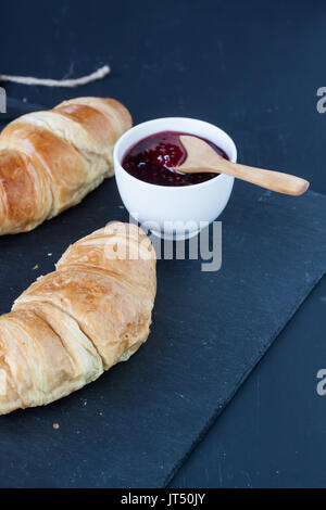 Croissant and raspberry jam Stock Photo