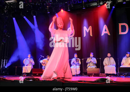 Noureddine Kourchid and the Whirling Dervishes of Damascus performing at the WOMAD Festival, Charlton Park, Malmesbury, Wiltshire, England, July 30, 2 Stock Photo