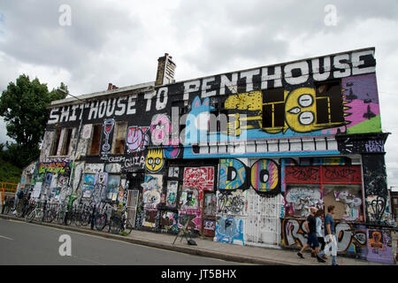 The Lord Napier, a disused pub, covered in graffiti, including the heading ' Shithouse to Penthouse', a comment on the gentrification of the area. Stock Photo