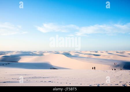 Lencois Maranhenses,Brazil, July 13, 2016 - Tourists are saying goodbye to the sun from Sand dunes with blue and green lagoons in Lencois Maranhenses  Stock Photo