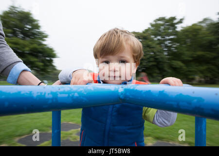Young Happy boy having fun at playground. Stock Photo