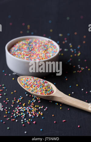 sugar sprinkles on a black background Stock Photo