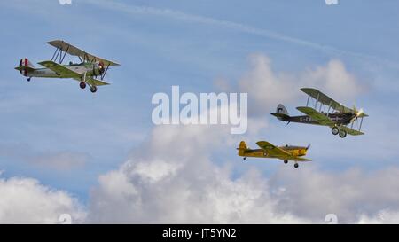 Avro 621Tutor, Miles Magister and DH.51 'MISS KENYA' flying in formation at Shuttleworth 2017 Edwardian Pageant Stock Photo